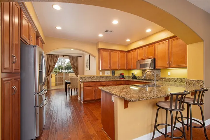 Looking from living room into the kitchen and the breakfast nook.