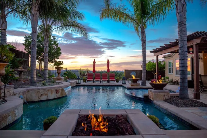 Raised seating area with fire-pit and views to the mountains, the sunsets, hot air balloons and evening lights!  Ocean views "peek" on a clear day or night!