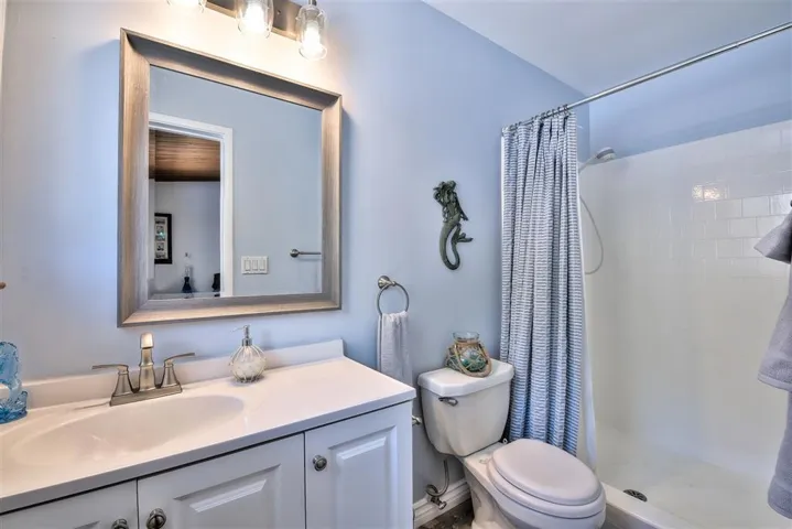 This bedroom and en suite bathroom is on the main  living area adjacent to the open kitchen and dining room area.