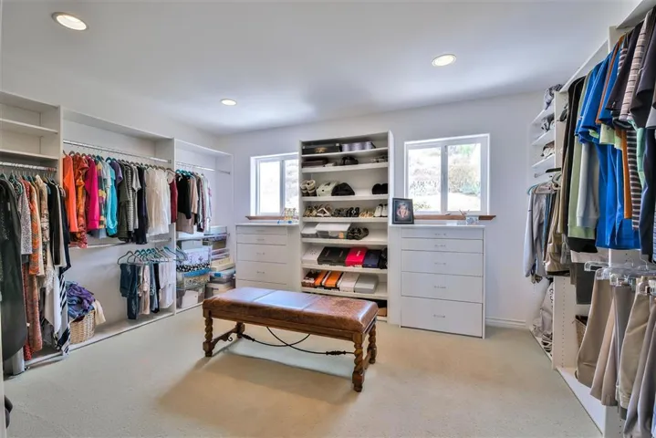 Master Walk in closet with built in storage and even windows. ( 14x11).