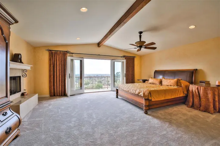 Upstairs Master Bedroom has Fireplace hearth and large balcony looking out to the Ocean Views.