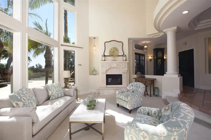 Two-story living room full of light
