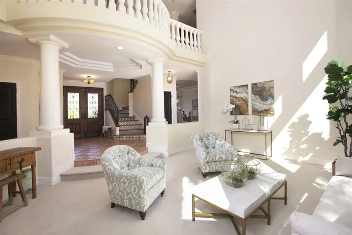 Two-story living room full of light