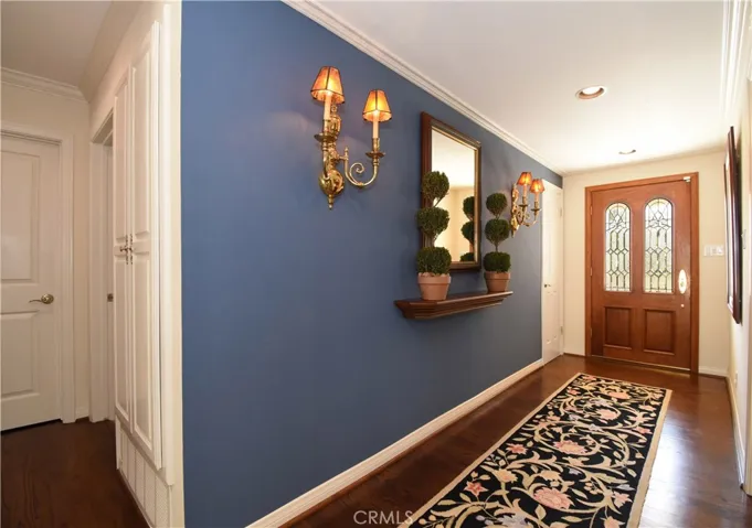 Formal entry features cedar lined coat closet.