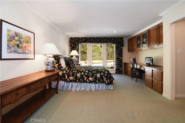 Extra large master with built in office space, sitting area, access to pool, massive walk in closet.