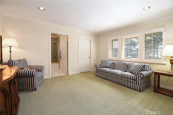 2nd master bedroom on 1st floor features full bath and walk in closet, plus built in work space.