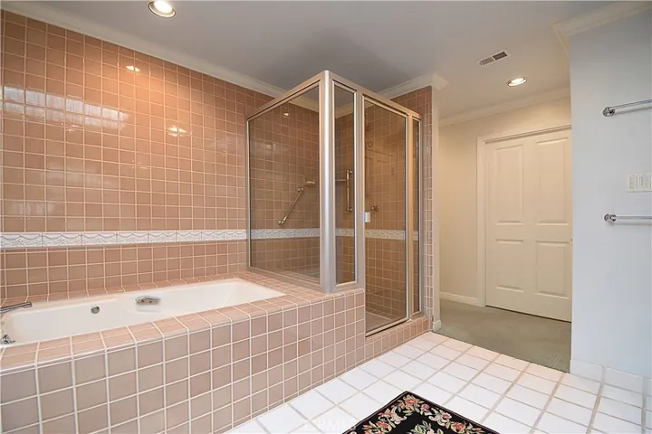 Large spa tub with separate shower.