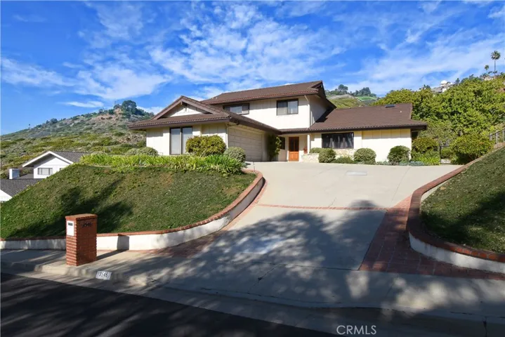 Street view. Large driveway with plenty of parking. Composite roof in great condition.