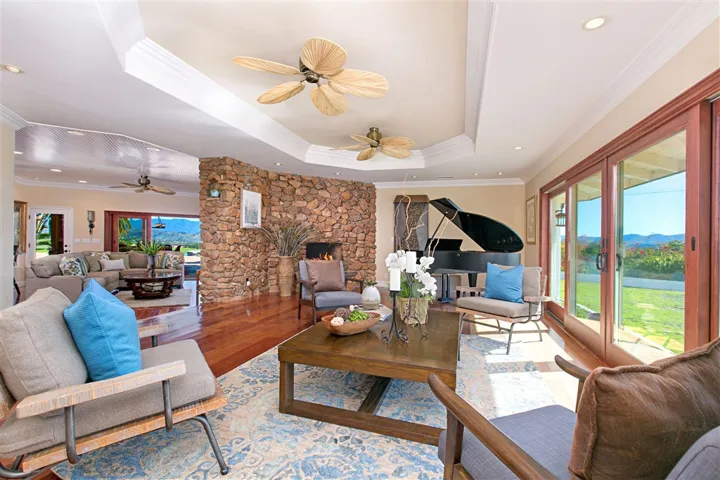 Brazillian Cherry wood floors. View to the West. Fireplace.