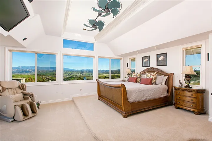 Spectacular views of the valleys and outdoor fireplace from the master bed.  Master bedroom has it's own 2 sided fireplace.