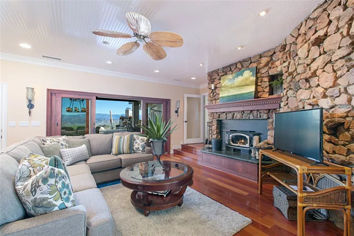 Cozy family room off the kitchen with wood burning stove. Can work as a heat source or for reflective ambience.