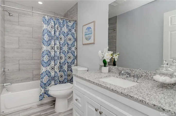 Oversize hall bath has large vanity and more designer details.