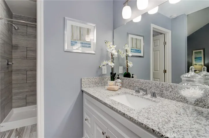 Completely remodeled master bath with separate shower and commode area and current designer details throughout.