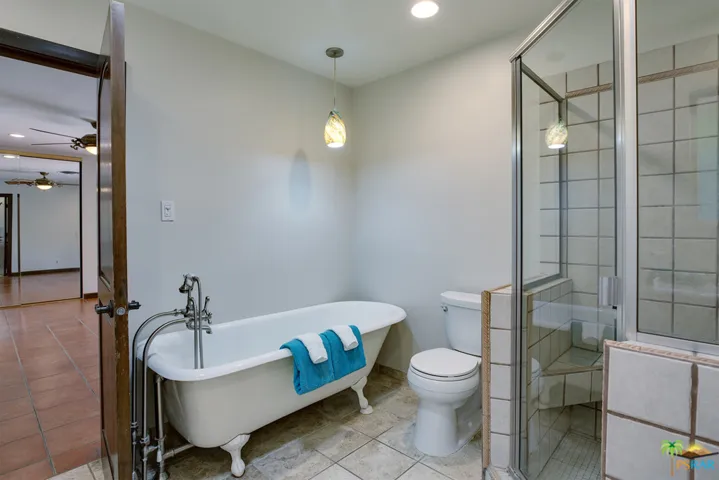 Master bathroom with claw foot tub and s