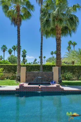 Elevated spa with water feature and stac