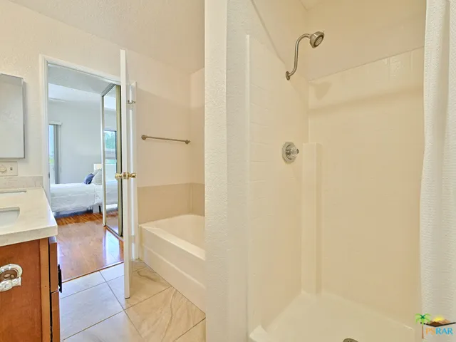 Walk-in shower and separate bath tub are