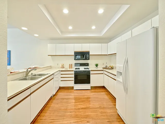 The bright, large kitchen features a new