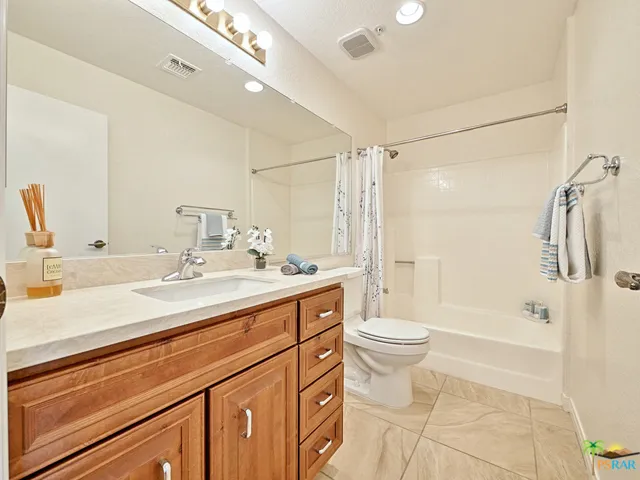 New vanity and tasteful tile flooring in