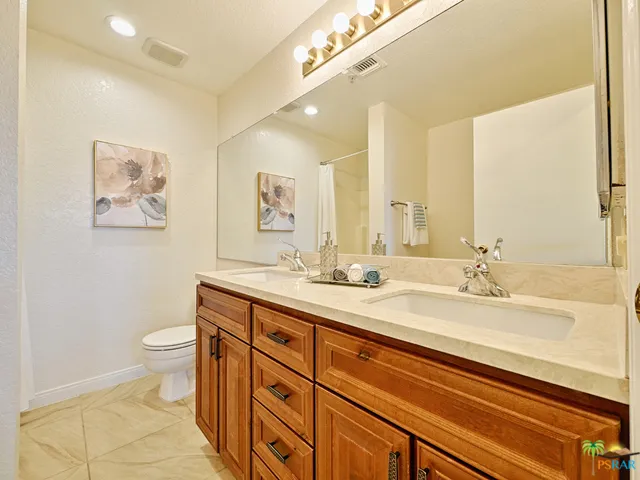 The master bedroom features a dual sink
