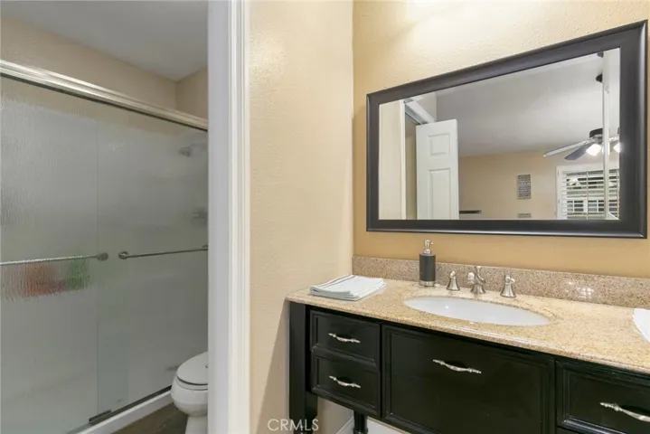 Master bath has spacious walk-in shower.  Toilet and shower are separate from vanity area.