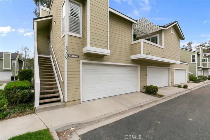 Two car attached garage has built-in cabinets for plenty of storage.
