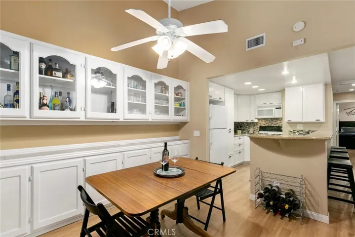 Custom built-in cabinets in dining area provide plenty of storage and a beautiful place to display books or dinnerware.