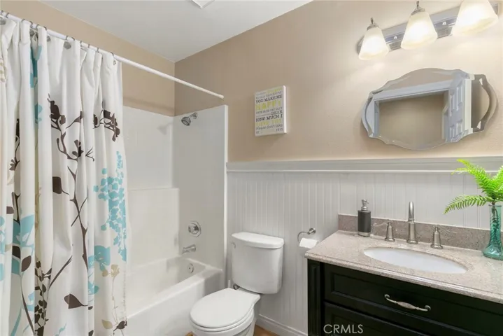 Full hall bath has been remodeled.  It has a shower over tub combination and upgraded vanity with granite countertop.