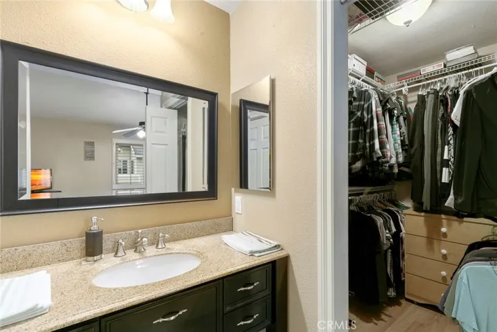 Master bath has been upgraded.  Beautiful vanity has granite countertop.  Note the walk-in closet.