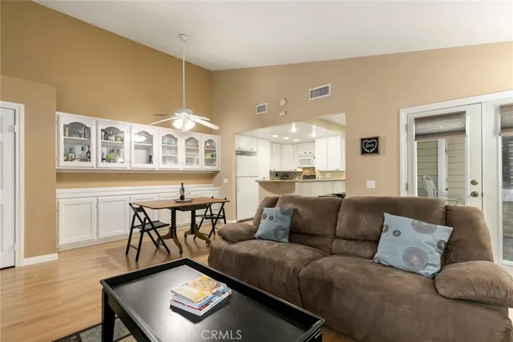It offers an open layout where living room flows into dining area and kitchen.