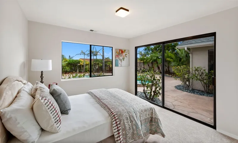 Looks out onto light bright patio and pool with sliding glass door.