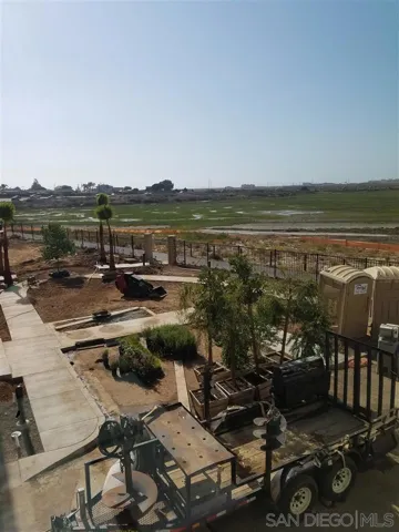 View from upstairs bedroom. This area is now finished and nicely landscaped. There are two outdoor guest parking spaces located here.