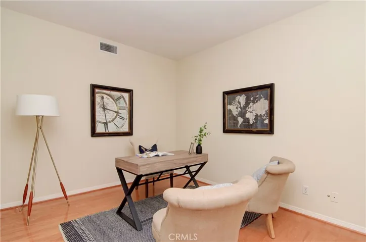 Large, downstairs den/office is separated from the family action to allow important work to get done.  This room could easily be converted to another downstairs bedroom!