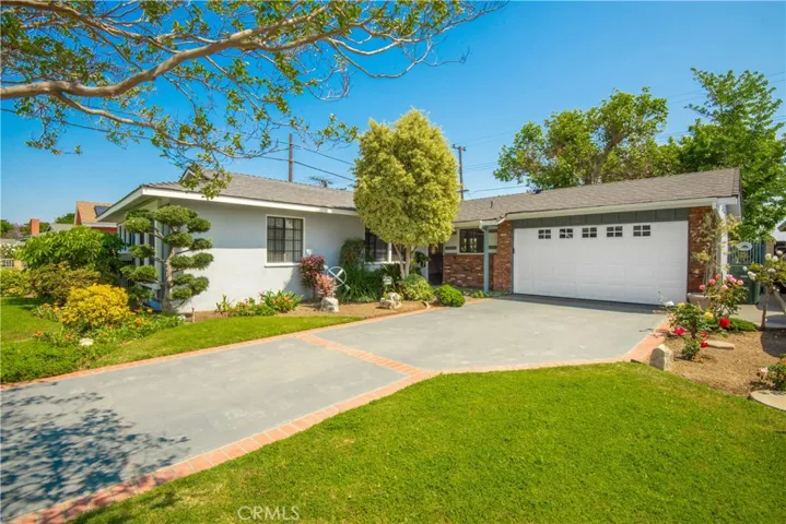 Great curb appeal with mature trees & lush landscaping