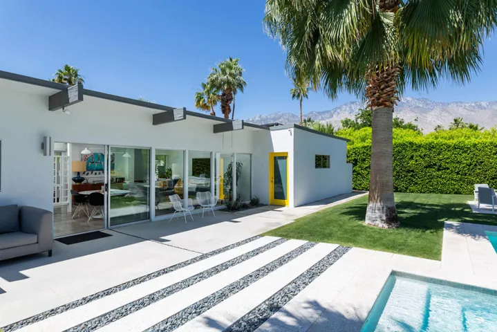 Yellow door is to the garage