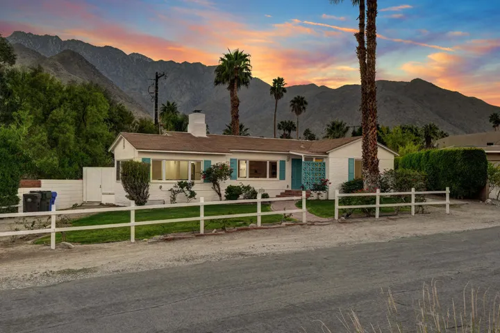 FRONT OF HOUSE TO MOUNTAINS DUSK MLS