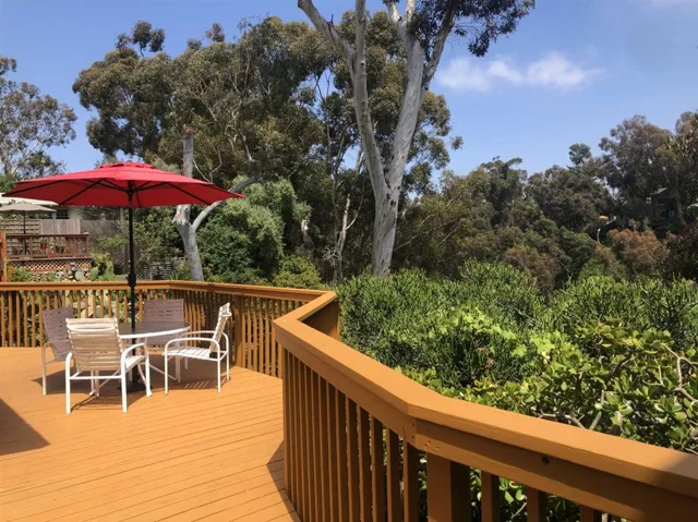 Backyard deck overlooking lush green canyon