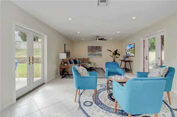 Such versatile space...room for pool table and many seating arrangements...beautiful French doors bring the outside in...from all sides.