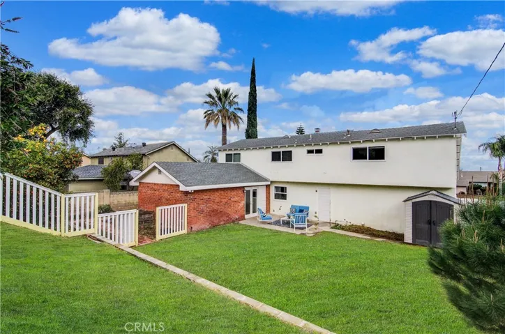 Huge back yard has different "rooms" to fit any family's needs...including gated RV access.