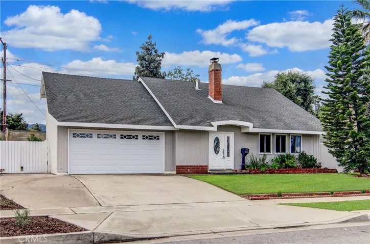 Nice street appeal with lush lawn and mature Star Pine.