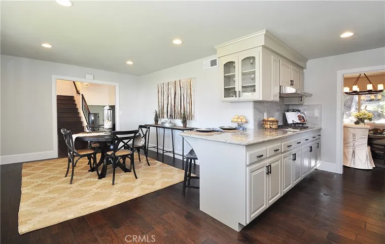 Kitchen has bar and eat in area, plus formal dining room.