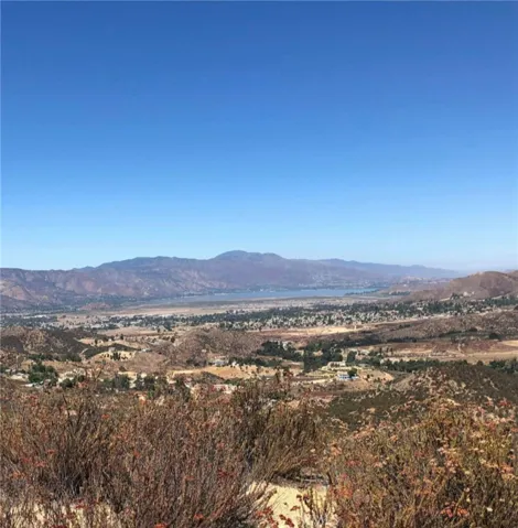 Gorgeous views from this hilltop parcel of approximately 20 acres. Sparking Lake Elsinore in the distance.