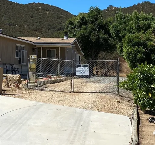 Through these gates up the dirt road, up the hill to the top to the 20 acre parcel.