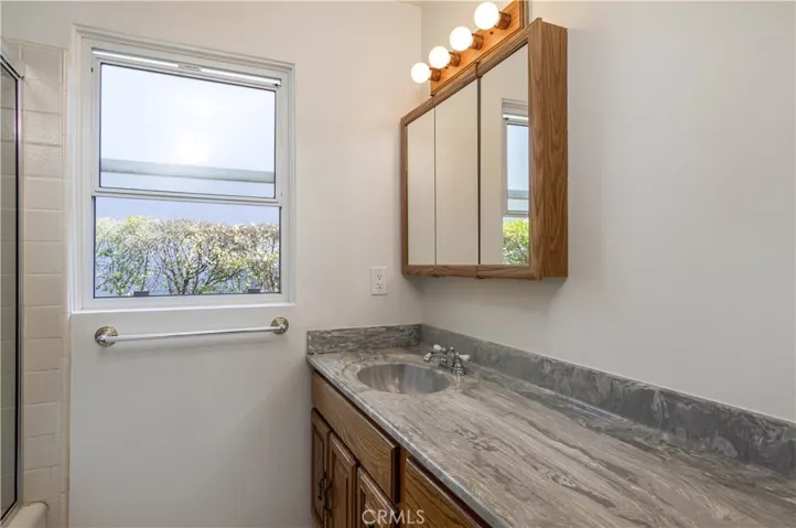This 3rd bathroom sits at the end of the hallway, close to Bedrooms #2, #3, and #4.