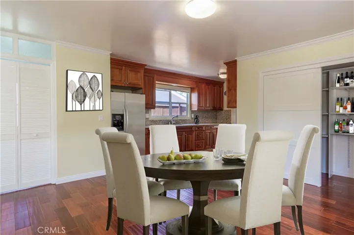 Virtually Staged Dining Area with view into Kitchen