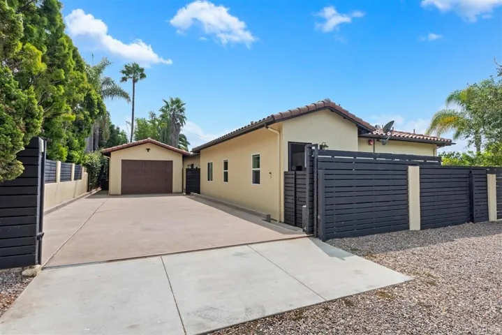 Detached oversized garage with ample room to park RV or other cars on the property