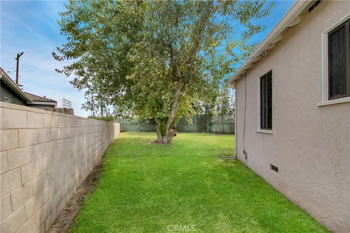 Privacy galore; the neighbors are not even close on either side! AND seller paid  for block walls. Property has been surveyed and they are 100% on this property.