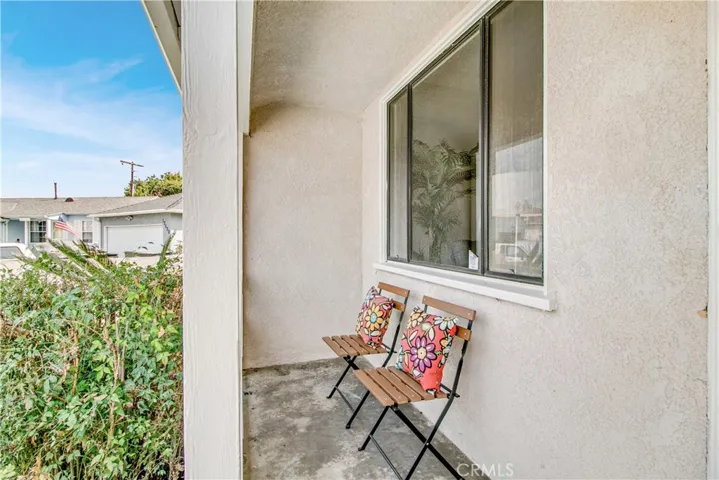Step-up to the traditional front porch as you enter.