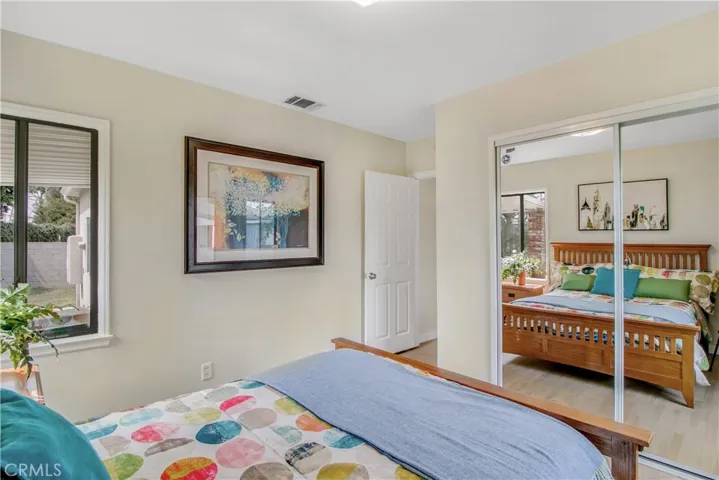 Spacious main bedroom has large mirrored wardrobe closet for your storage needs!