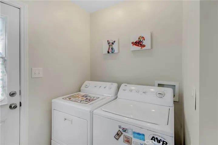 Convenient full sized laundry area with easy access to side yard utility area.  And, just two steps to the right to the exterior pedestrian door to garage!
