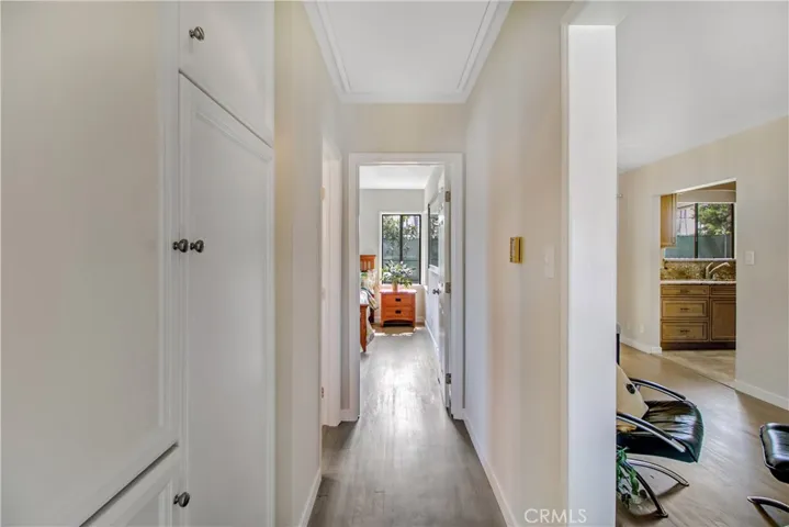 Original hardwood floors flow through most of the home. Huge linen/storage cabinets perfectly situated in this hallway.